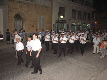 I8 Victory Band marches up 8th Sept Avenue