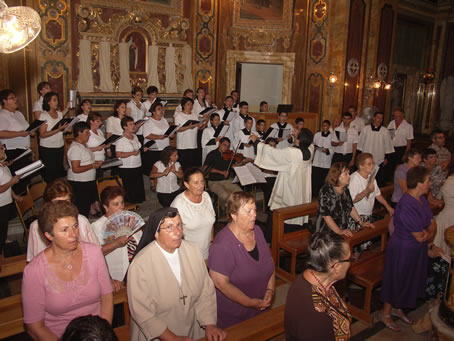 C8 Sem Mario Curmi in background on the organ