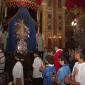 B3 Archpriest passes in front of the statue