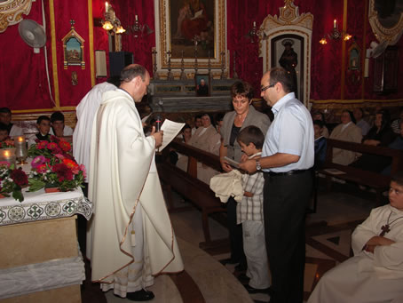 B1 Joachim Buttigieg, candidate for altar boy, with parents