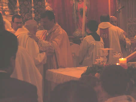 G8 Bishop and Archpriest Emeritus embrace in peace