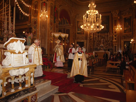 A6 Archpriest holds the monstrance with the Holy Eucharist