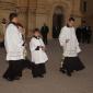 B1 Two altar boys precede the Holy Eucharist