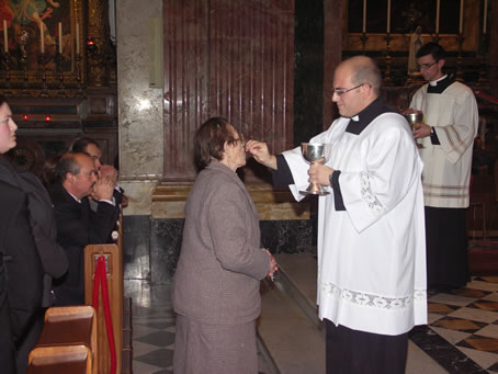 61 Mark's grandmother eceives Holy Communion