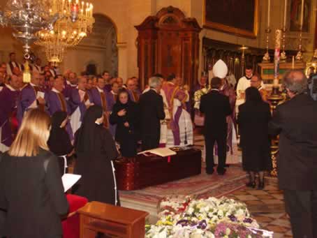 141 Presenting the offerings to Bishop Mario Grech