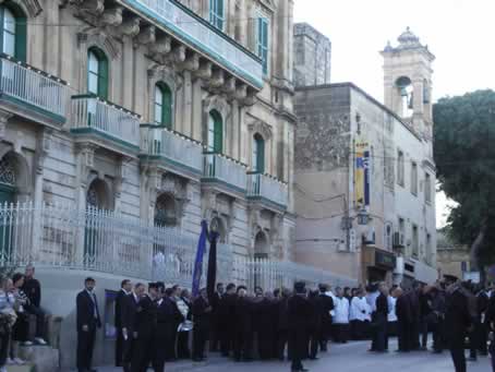 001 Mourners wait in front of the Gozo Curia