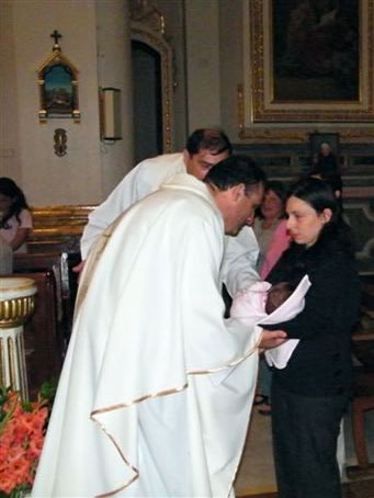 35 Fr Joe Xerri Ofm Conv. presented with a baby