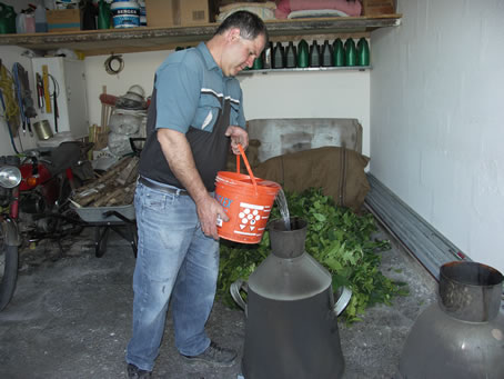 038 filling the pot with a pail of water