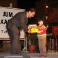 G3 Mayor presents books to a toddler