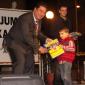 G2 Mayor presents books to a toddler