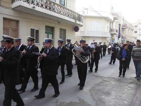 A5 Victory Band marches down Triq il-Qbajja