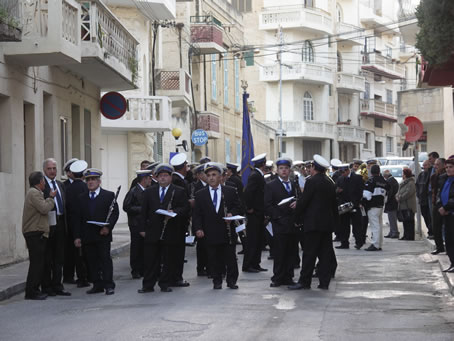 A6 Victory Band marches down Triq il-Qbajja