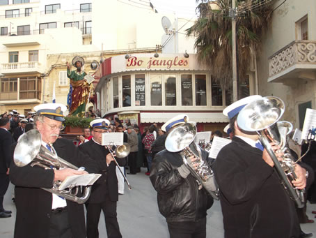 C9 Victory Band marches in froint of statue