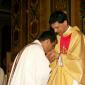 182 Priest kissing Fr Caruana's hands