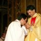 181 Priest kissing Fr Caruana's hands