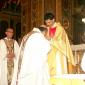 183 Priest kissing Fr Caruana's hands