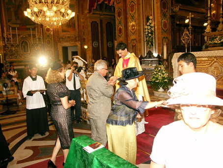 189 Uncle kissing Fr Caruana's hands