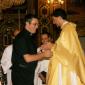 186 Deacon Simon Cachia kissing Fr Caruana's hands