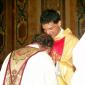 180 Priest kissing Fr Caruana's hands