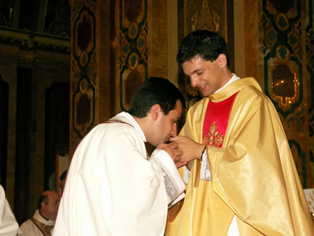 181 Priest kissing Fr Caruana's hands