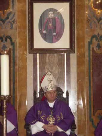 26 Photo of Bishop Cauchi hangs over Bishop Grech