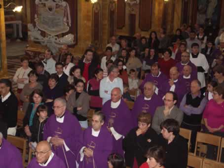 12 Chapter and Clergy in procession to the Altar