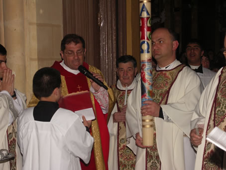 A3 Arch C Refalo prays at start of service