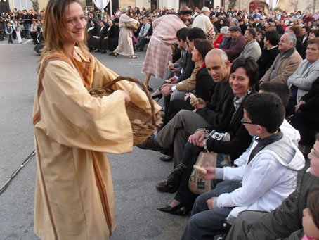 E7 Distributing bread to the hungry crowd