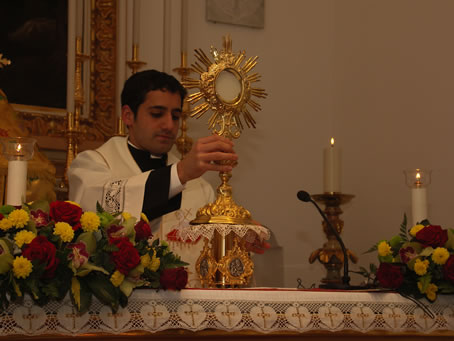 H2 Fr Anthony Bajada exposing the Holy Eucharist