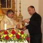 B5 Can J Sultana pours water on Fr Zammit's hands