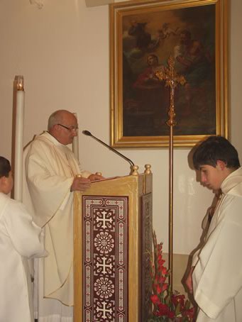 C1 Fr Ceorge Camilleri SJ reading the Gospel