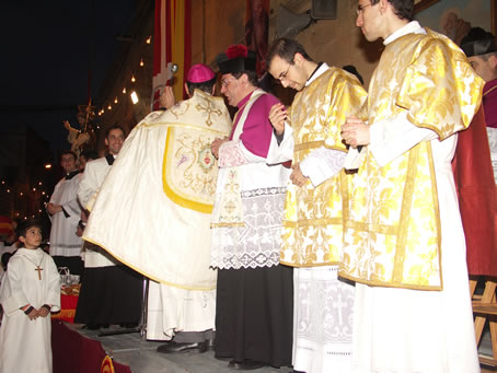 F8 Sprinkling Holy Water on man and animal