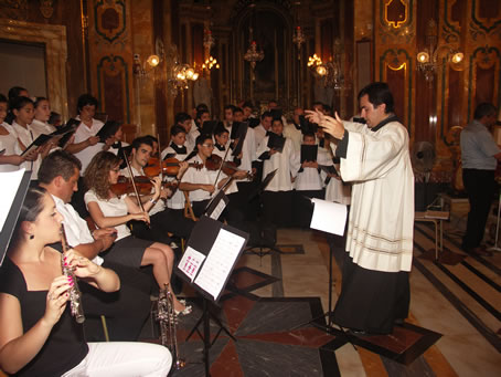 022 Fr Michael Curmi directing Choir and Orchestra