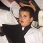 023 Young altar boy singing with the choir