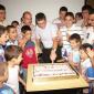 32 Deacon Simon Mario Cachia cutting the cake