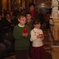 I5 Children who will receive Holy Communion this year offer a candle