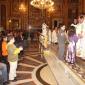 H6 Children who will receive Holy Communion this year offer a candle