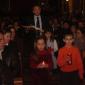 I9 Children who will receive Holy Communion this year offer a candle