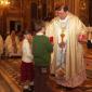 I6 Children who will receive Holy Communion this year offer a candle