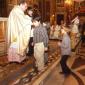 J4 Children who will receive Holy Communion this year offer a candle