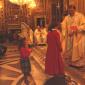 J8 Girl who will receive Holy Communion this year offers a candle