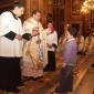 I2 Children who will receive Holy Communion this year offer a candle