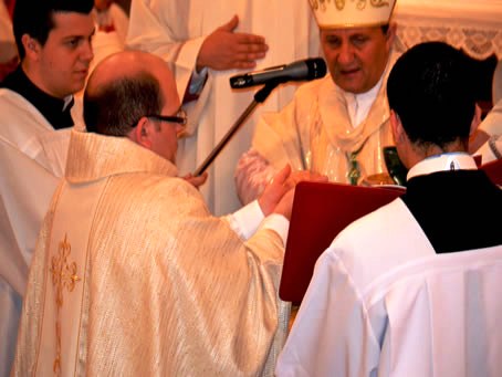 085 Bishop anointing Mark's hands with Sacred Oils