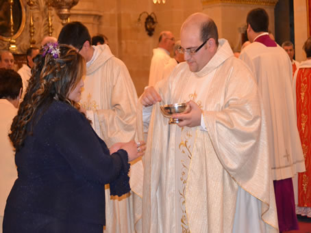 188 Fr Mark's sister  Sylvana receives Holy Communion