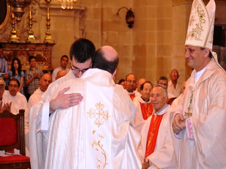 149 The two new priests embrace