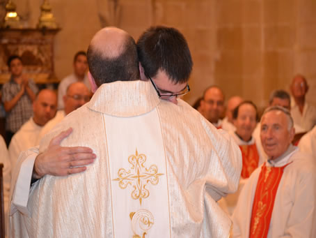 150 The two new priests embrace