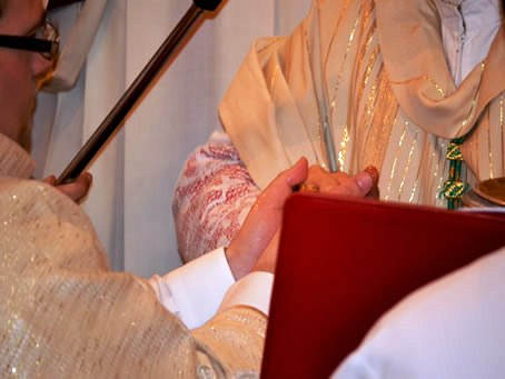 086 Bishop anointing Mark's hands with Sacred Oils