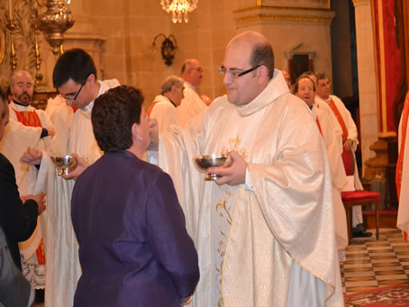 186 Fr Mark's mother Lily receives Holy Communion