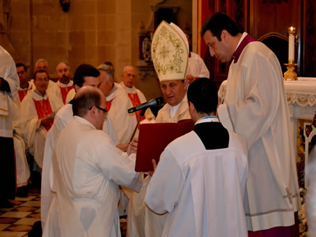 041 Bishop recites prayers while holding Mark's hands