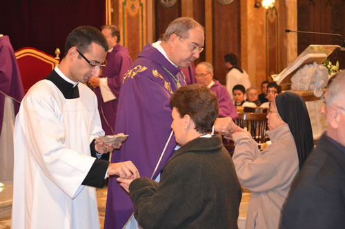 111 Daniel's mother receives Holy Communion from her son